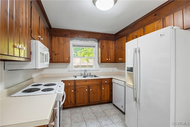 13917 Barnes Spring Rd, Midlothian, VA 23112 - kitchen with white appliances, a sink, brown cabinetry, light tile patterned floors, and light countertops