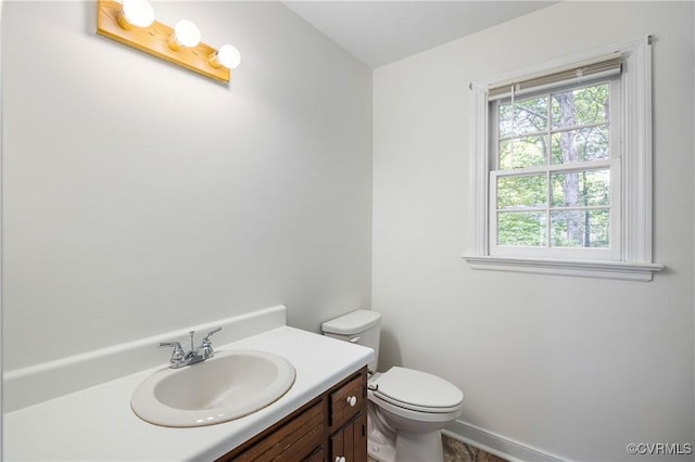 13917 Barnes Spring Rd, Midlothian, VA 23112 - bathroom with toilet, vanity, and baseboards