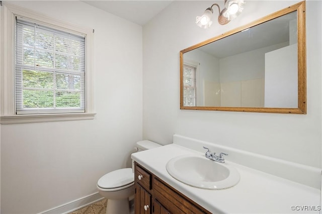 13917 Barnes Spring Rd, Midlothian, VA 23112 - bathroom with plenty of natural light, toilet, vanity, and baseboards