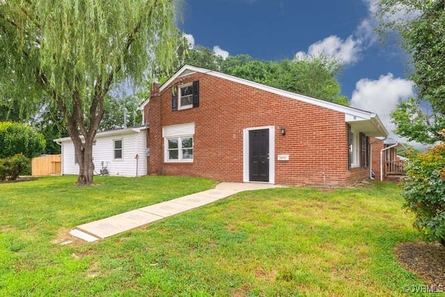 102 Hargrave Ave, Colonial Heights, VA 23834 - rear view of property with brick siding and a yard