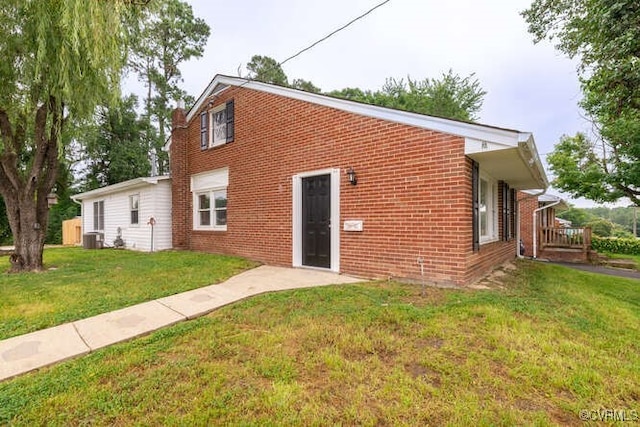 102 Hargrave Ave, Colonial Heights, VA 23834 - back of house with brick siding and a yard