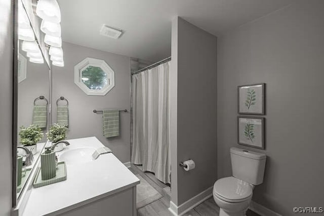 102 Hargrave Ave, Colonial Heights, VA 23834 - bathroom featuring vanity, a shower with shower curtain, and wood finished floors