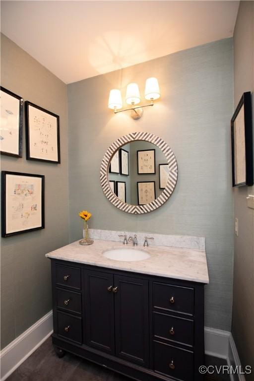 908 High St, Farmville, VA 23901 - bathroom featuring baseboards and vanity