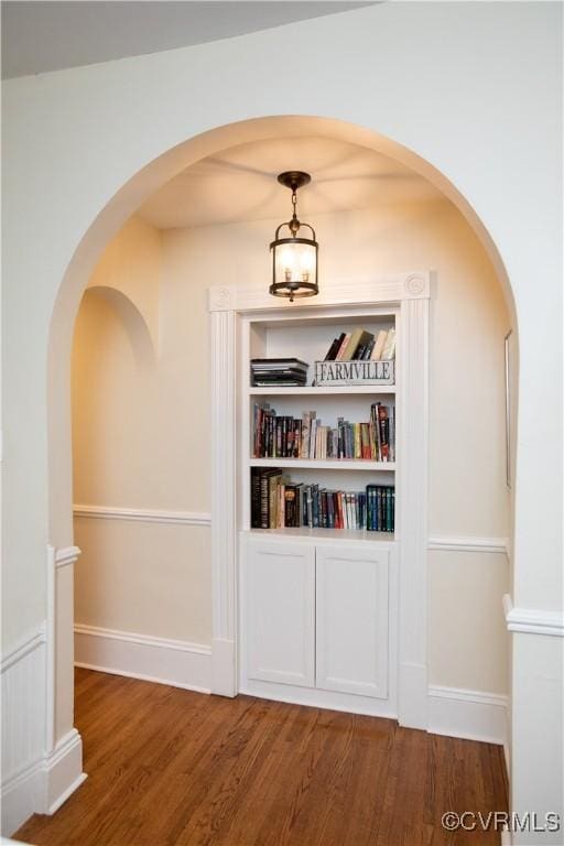 908 High St, Farmville, VA 23901 - hallway with wood finished floors, arched walkways, and baseboards
