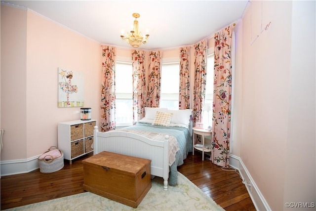 908 High St, Farmville, VA 23901 - bedroom with hardwood / wood-style flooring, a chandelier, and baseboards