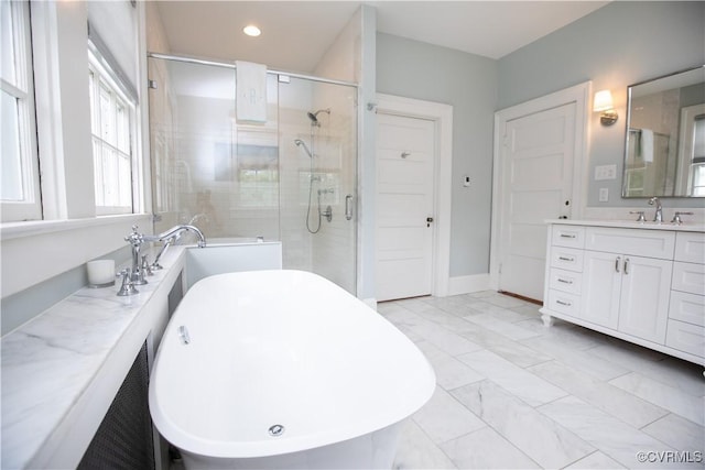 908 High St, Farmville, VA 23901 - full bathroom featuring a stall shower, marble look tile flooring, vanity, a soaking tub, and recessed lighting