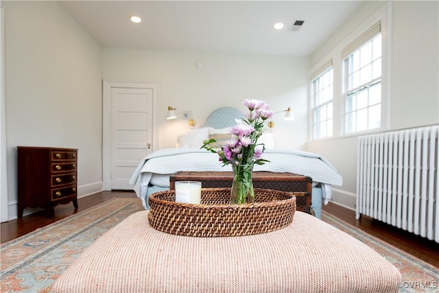 908 High St, Farmville, VA 23901 - bedroom with radiator, wood finished floors, baseboards, and recessed lighting
