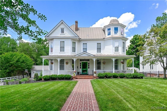 908 High St, Farmville, VA 23901 - victorian house featuring a porch, a chimney, metal roof, and a standing seam roof