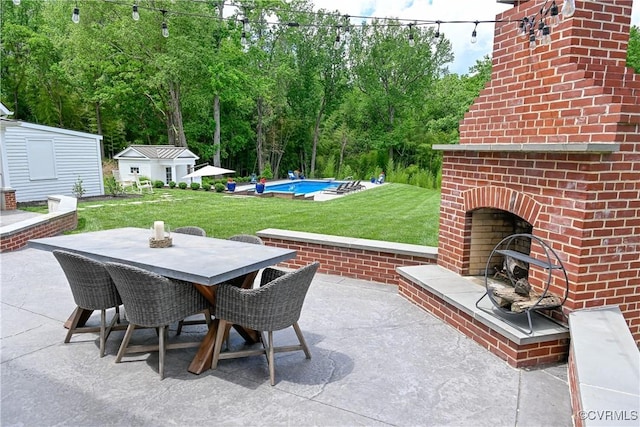 908 High St, Farmville, VA 23901 - view of patio / terrace featuring an outdoor brick fireplace, outdoor dining area, an outdoor pool, and view of scattered trees