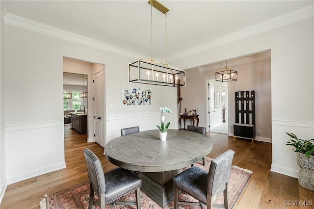 4507 Summer Camp Ct, Moseley, VA 23120 - dining space with a chandelier, wood finished floors, crown molding, and baseboards
