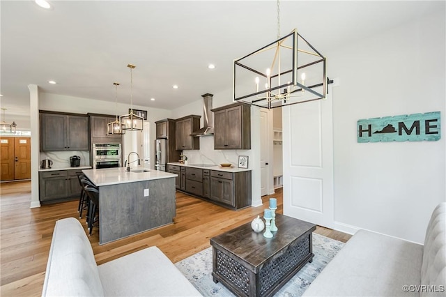 4507 Summer Camp Ct, Moseley, VA 23120 - living room with a chandelier, light wood finished floors, recessed lighting, and baseboards