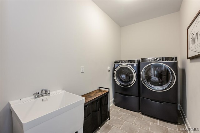 4507 Summer Camp Ct, Moseley, VA 23120 - laundry room featuring washing machine and clothes dryer, baseboards, and light tile patterned floors