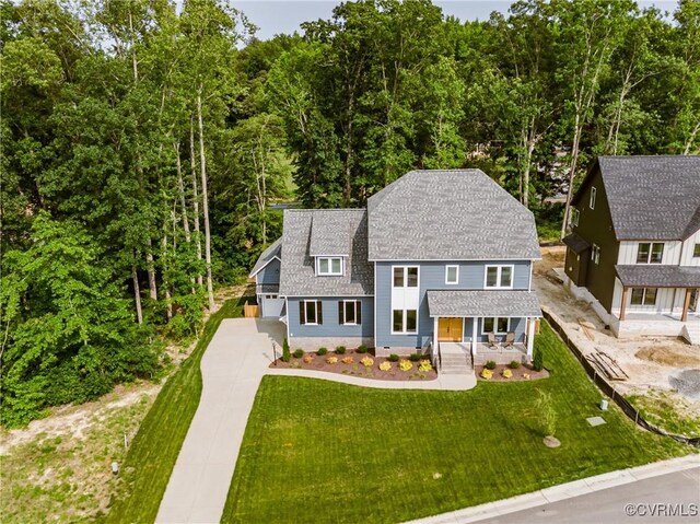 4507 Summer Camp Ct, Moseley, VA 23120 - view of front facade featuring covered porch, driveway, a shingled roof, and a front yard