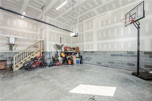 4507 Summer Camp Ct, Moseley, VA 23120 - garage featuring a garage door opener and concrete block wall