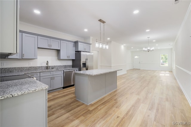 11800 Shady Ln, Chesterfield, VA 23831 - kitchen with appliances with stainless steel finishes, gray cabinetry, a sink, a chandelier, and a center island