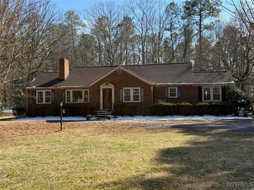 2016 Dodson Rd, Petersburg, VA 23805 - single story home featuring a chimney, a front yard, and brick siding