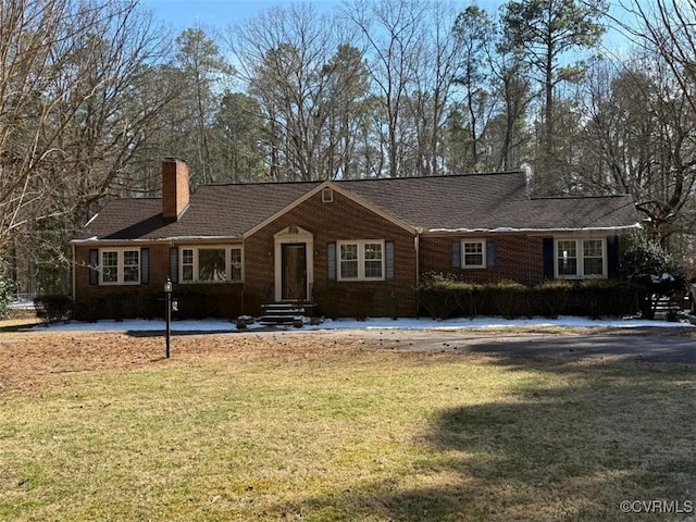 2016 Dodson Rd, Petersburg, VA 23805 - single story home featuring a chimney, a front yard, and brick siding