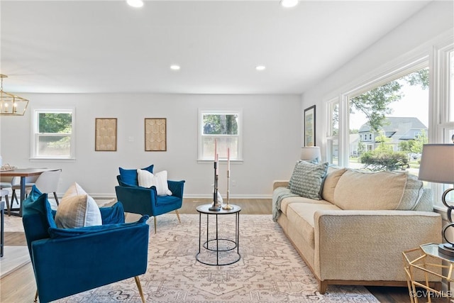 713 Chapman St, Ashland, VA 23005 - living area featuring plenty of natural light, wood finished floors, recessed lighting, a chandelier, and baseboards