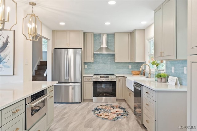 713 Chapman St, Ashland, VA 23005 - kitchen featuring stainless steel appliances, wall chimney exhaust hood, tasteful backsplash, light countertops, and recessed lighting