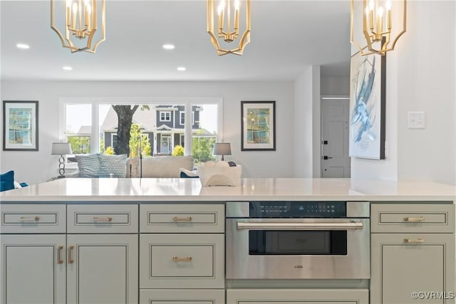 713 Chapman St, Ashland, VA 23005 - kitchen featuring a chandelier, open floor plan, oven, light countertops, and recessed lighting