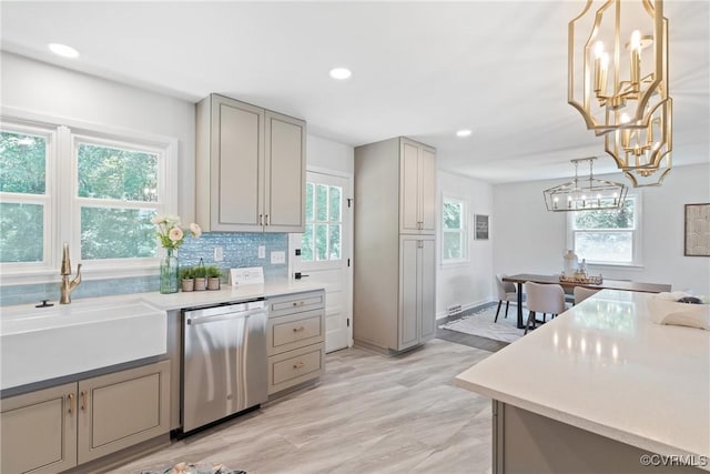 713 Chapman St, Ashland, VA 23005 - kitchen with dishwasher, gray cabinets, a sink, a chandelier, and light countertops