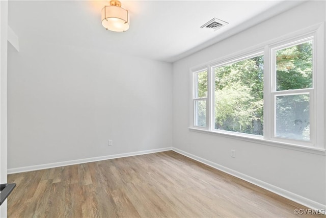 713 Chapman St, Ashland, VA 23005 - spare room featuring wood finished floors and baseboards