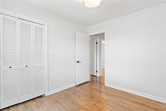 713 Chapman St, Ashland, VA 23005 - unfurnished bedroom with a closet, light wood finished floors, and baseboards
