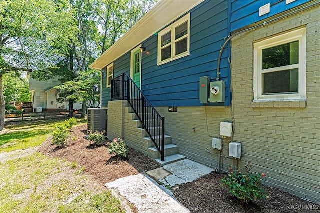 713 Chapman St, Ashland, VA 23005 - entrance to property featuring central AC and brick siding