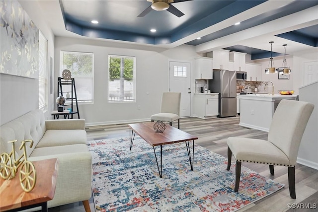 1114 Hinton St, Petersburg, VA 23803 - living area with a tray ceiling, ceiling fan, light wood-style floors, baseboards, and recessed lighting