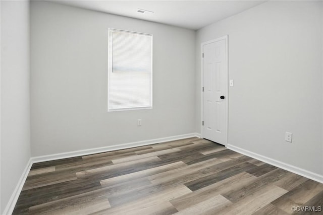 1114 Hinton St, Petersburg, VA 23803 - spare room with wood finished floors and baseboards