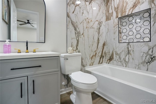 1114 Hinton St, Petersburg, VA 23803 - bathroom featuring wood finished floors, toilet, vanity, a ceiling fan, and  shower combination