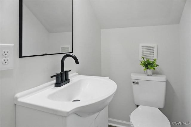 1114 Hinton St, Petersburg, VA 23803 - bathroom featuring toilet, vanity, and baseboards