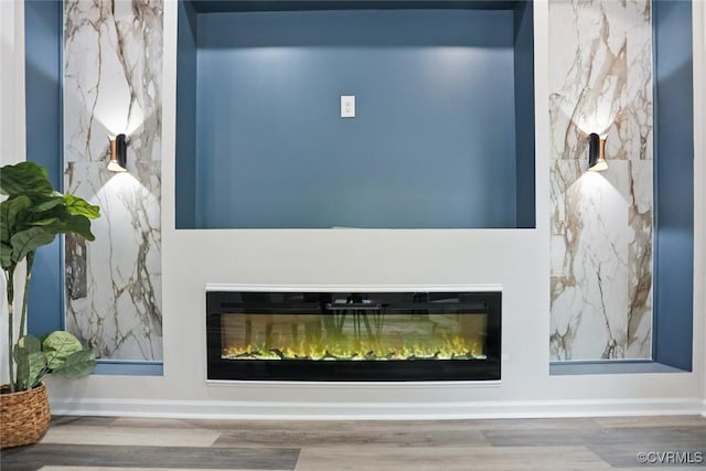 1114 Hinton St, Petersburg, VA 23803 - detailed view of a glass covered fireplace, wood finished floors, and baseboards