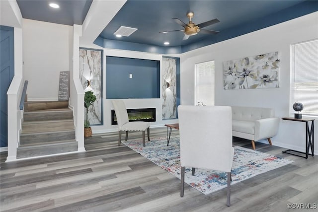 1114 Hinton St, Petersburg, VA 23803 - living room with wood finished floors, ceiling fan, stairway, a glass covered fireplace, and recessed lighting