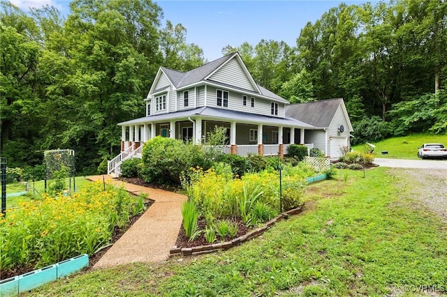 11021 Grub Hill Church Rd, Amelia Courthouse, VA 23002 - view of front of property featuring a vegetable garden, a porch, a front yard, a garage, and driveway