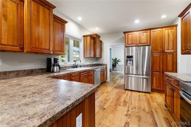 11021 Grub Hill Church Rd, Amelia Courthouse, VA 23002 - kitchen featuring appliances with stainless steel finishes, brown cabinets, light wood finished floors, recessed lighting, and dark countertops