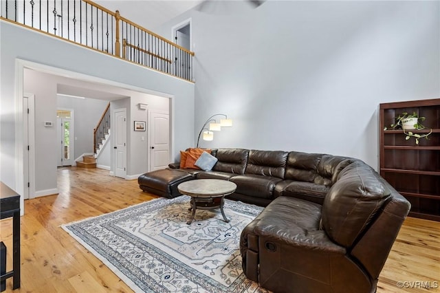 11021 Grub Hill Church Rd, Amelia Courthouse, VA 23002 - living room with a high ceiling, stairway, and wood finished floors