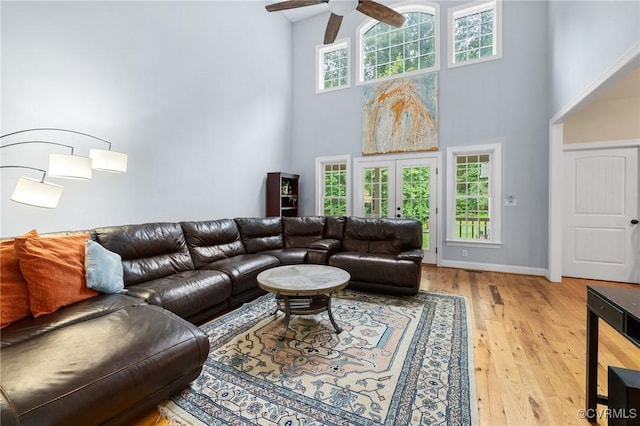 11021 Grub Hill Church Rd, Amelia Courthouse, VA 23002 - living room featuring a towering ceiling, a ceiling fan, and light wood-type flooring