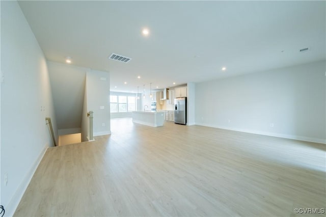 4302 Weaver Brook Rd Unit B, Glen Allen, VA 23233 - unfurnished living room with recessed lighting, light wood finished floors, baseboards, and a sink