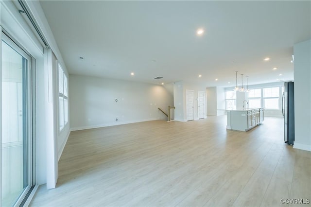 4302 Weaver Brook Rd Unit B, Glen Allen, VA 23233 - unfurnished living room with light wood-type flooring, recessed lighting, a sink, and baseboards