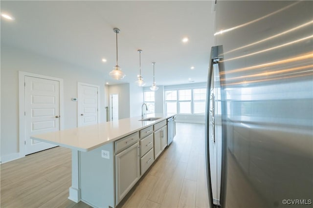4302 Weaver Brook Rd Unit B, Glen Allen, VA 23233 - kitchen featuring appliances with stainless steel finishes, a sink, light wood finished floors, light countertops, and recessed lighting