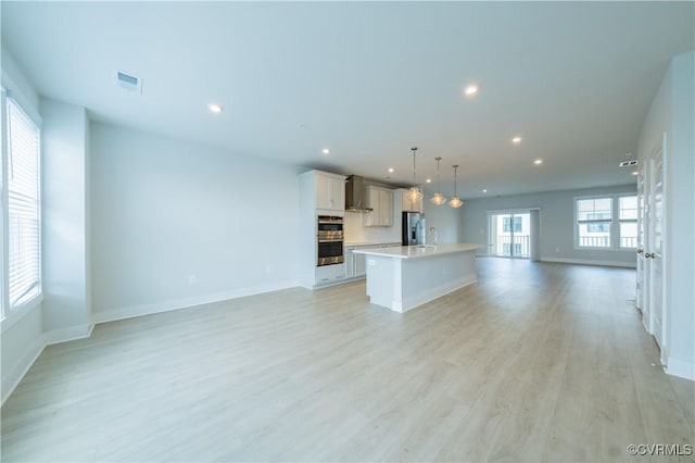 4302 Weaver Brook Rd Unit B, Glen Allen, VA 23233 - unfurnished living room with recessed lighting, a sink, light wood-style floors, and baseboards