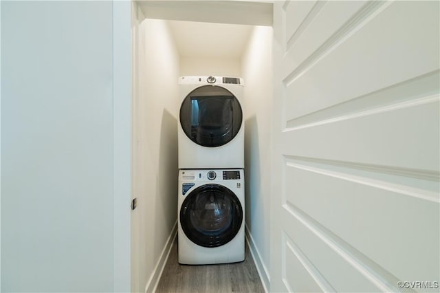 4302 Weaver Brook Rd Unit B, Glen Allen, VA 23233 - laundry area with stacked washing machine and dryer, wood finished floors, and baseboards