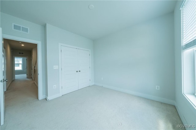 4302 Weaver Brook Rd Unit B, Glen Allen, VA 23233 - unfurnished bedroom featuring light colored carpet, baseboards, and a closet