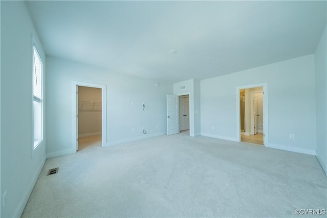 4302 Weaver Brook Rd Unit B, Glen Allen, VA 23233 - unfurnished bedroom with light carpet, a spacious closet, and baseboards
