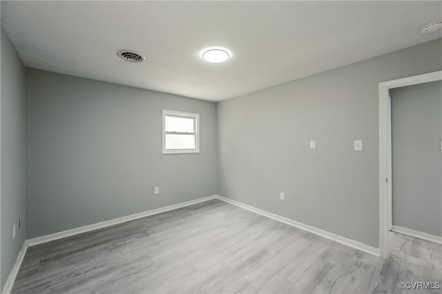 2533 Merle St, Henrico, VA 23231 - empty room with wood finished floors, baseboards, and a smoke detector