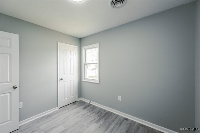2533 Merle St, Henrico, VA 23231 - unfurnished bedroom with wood finished floors, baseboards, and a closet