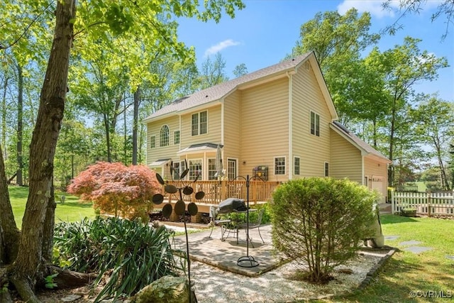 2024 Judes Ferry Rd, Powhatan, VA 23139 - rear view of property featuring a deck, a patio, and a garage