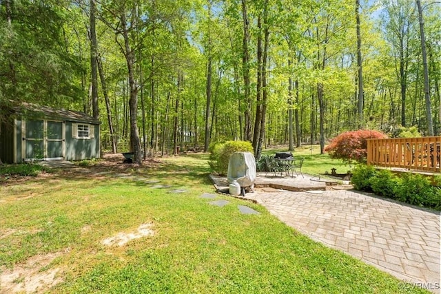 2024 Judes Ferry Rd, Powhatan, VA 23139 - view of grassy yard featuring a patio and an outbuilding