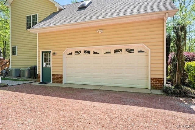 2024 Judes Ferry Rd, Powhatan, VA 23139 - garage featuring driveway and central AC
